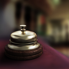 Hotel reception bell within dimly lit hotel, such lighting can render poor quality video surveillance