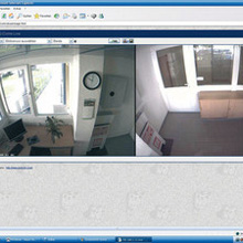 The monitor image shows the layout of both buildings and small surveillance images are displayed on the screen at each of the camera locations